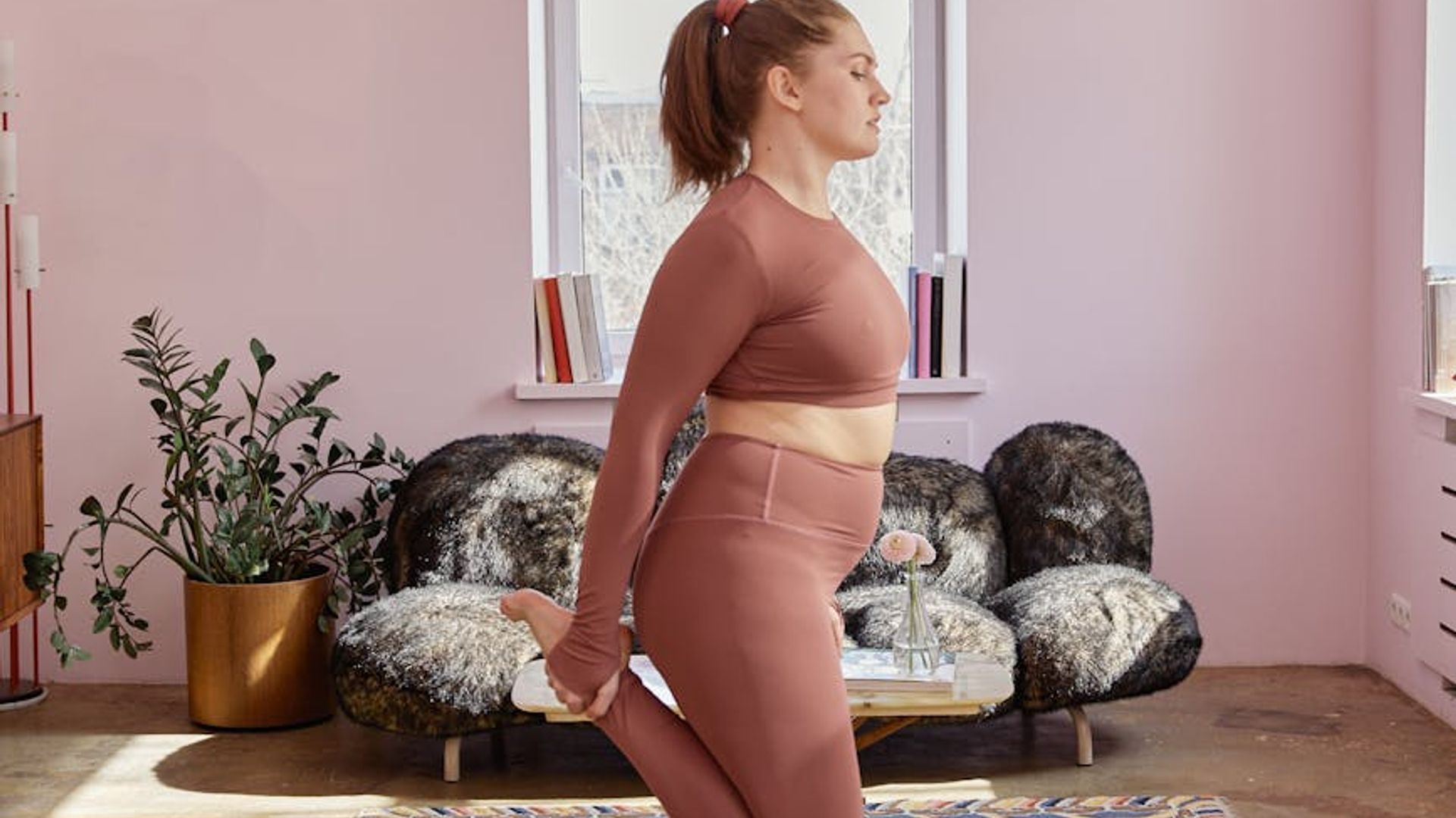 Calm and focused person practicing yoga in a minimalist space.